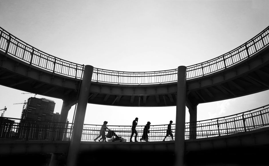 Pedestrian bridge crossing over a busy roadway