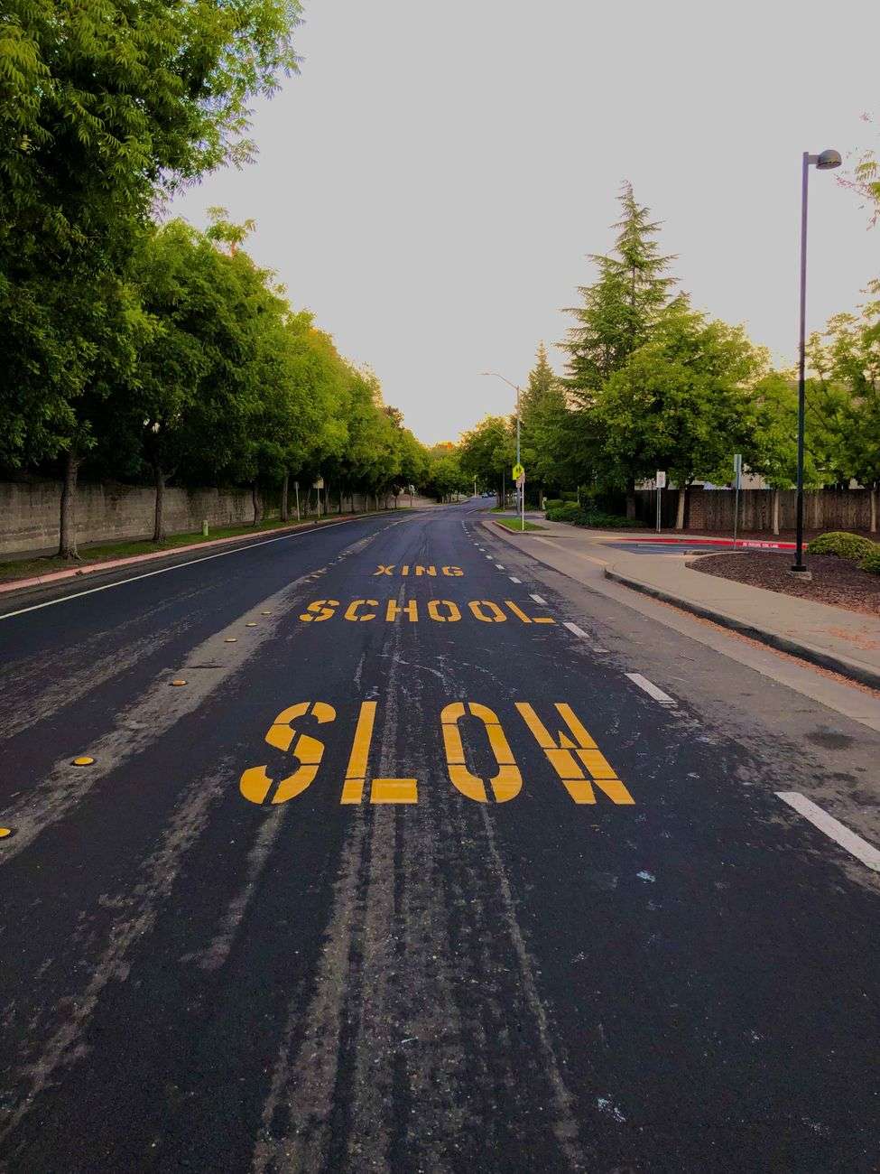 Pedestrian crossing sign on a street near a school zone