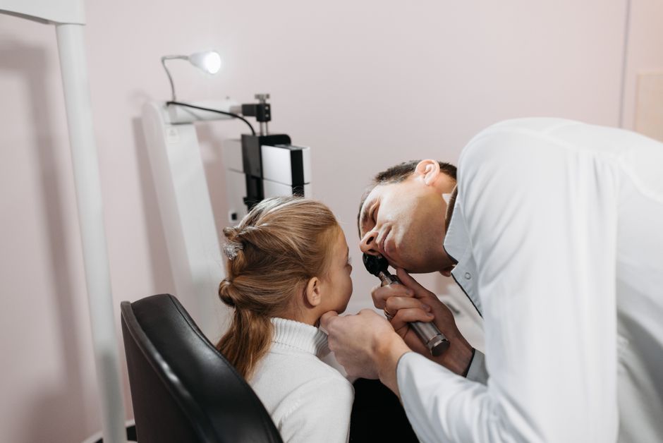 A child receiving a health checkup, representing concerns about respiratory illness in Mobile County
