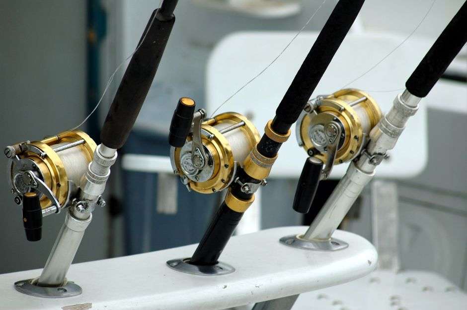 Fishing rods lined up on a charter boat used for offshore red snapper trips