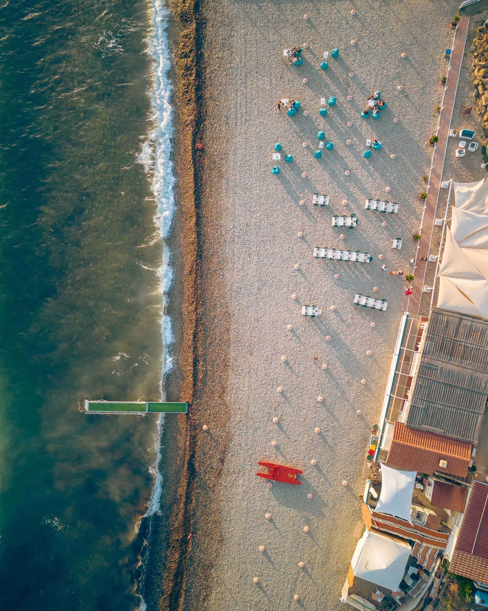 An aerial view of a white sand beach along the Alabama Gulf Coast