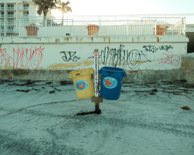 Trash and recycling bins along the public beach at Gulf Shores, Alabama
