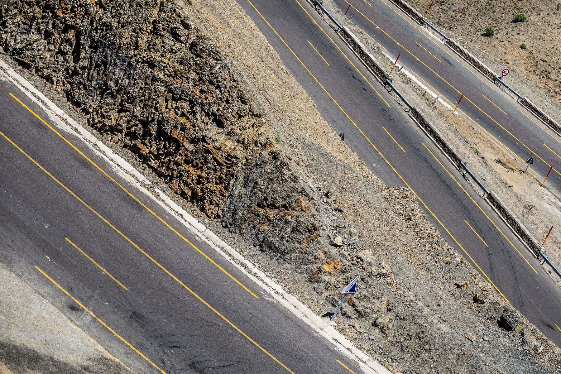 Roadway construction site with equipment expanding a highway
