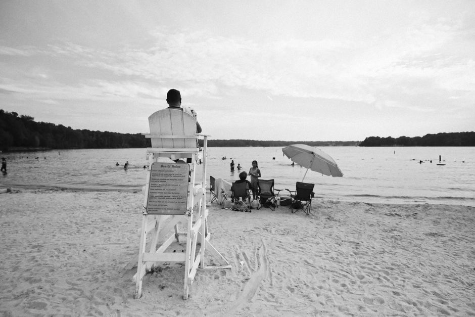 Families swimming and enjoying a lake on a summer afternoon