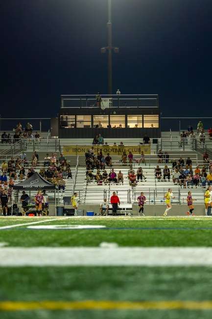 Youth football stadium bleachers and stands under stadium lights