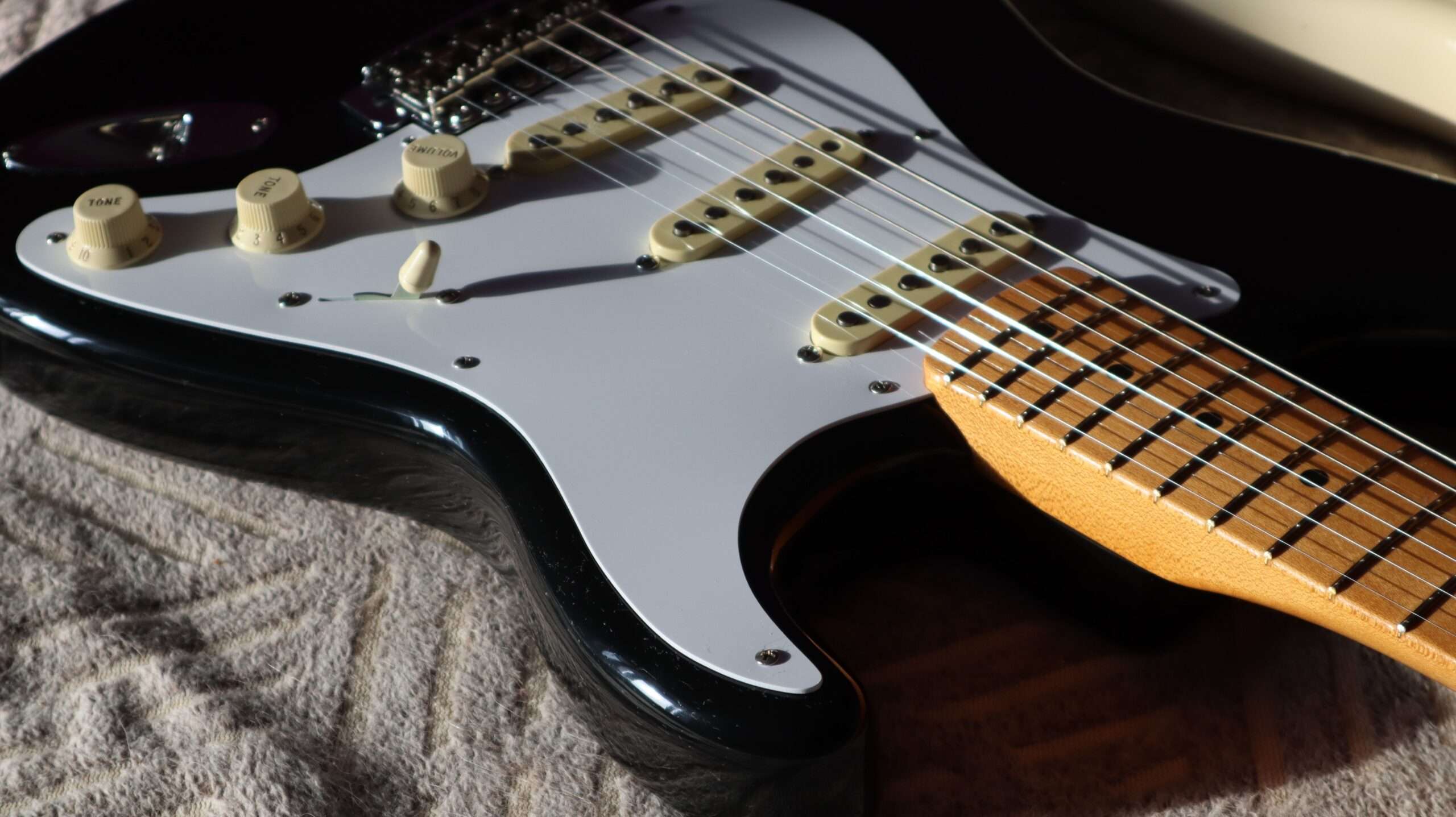 Close-up of an electric blues guitar, representing the music of Mobile-area blues artist Hank Becker
