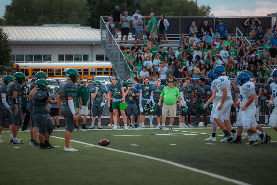 High school football players and fans at a Friday night game
