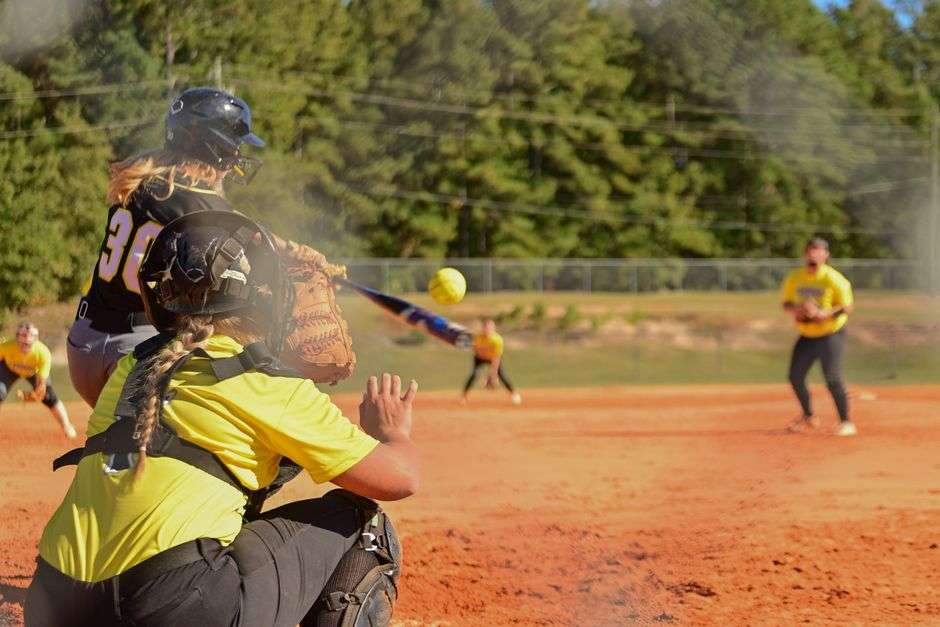 High school softball players in action during a game