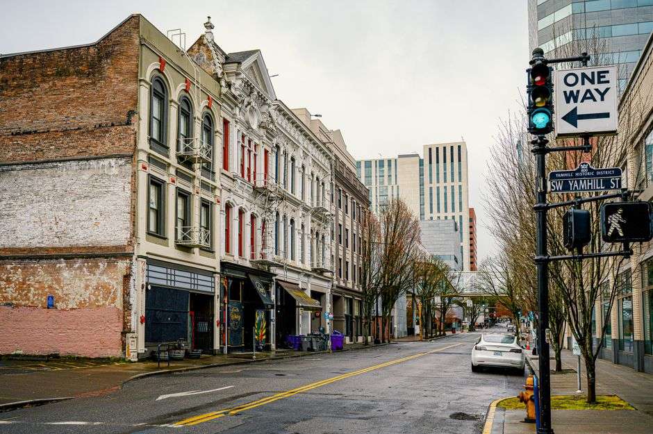 A quiet historic street in downtown Mobile, Alabama lined with old buildings