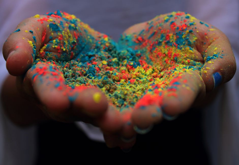 Colorful powder thrown during a Holi festival celebration in Mobile
