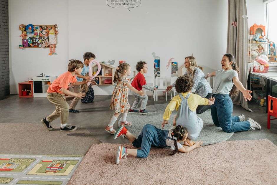 Young children playing together in a home care setting