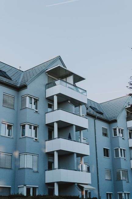Exterior of a modern multi-family apartment complex representing new affordable housing