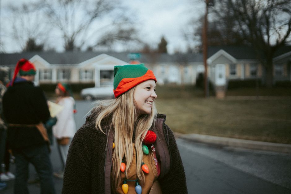 Person in elf costume during a holiday community event