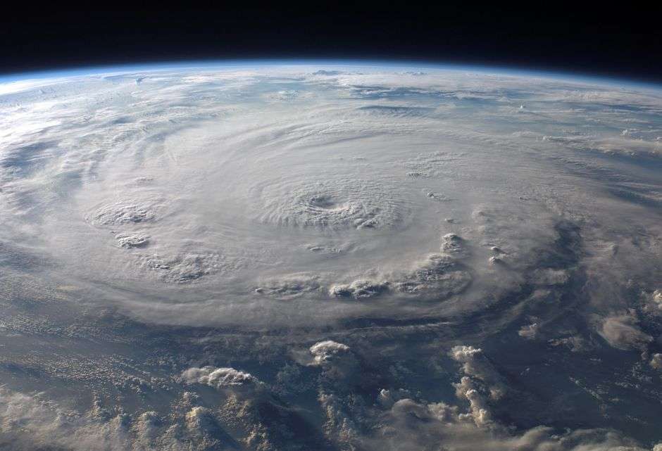 Satellite image of a hurricane spinning over open ocean water