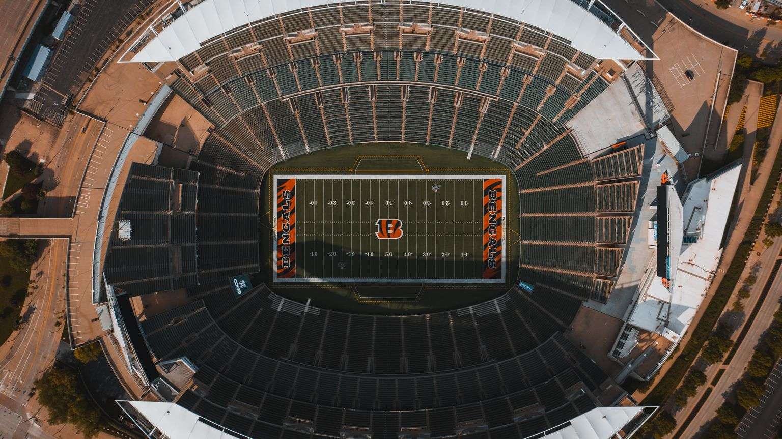 Empty grandstands and field of a college football stadium