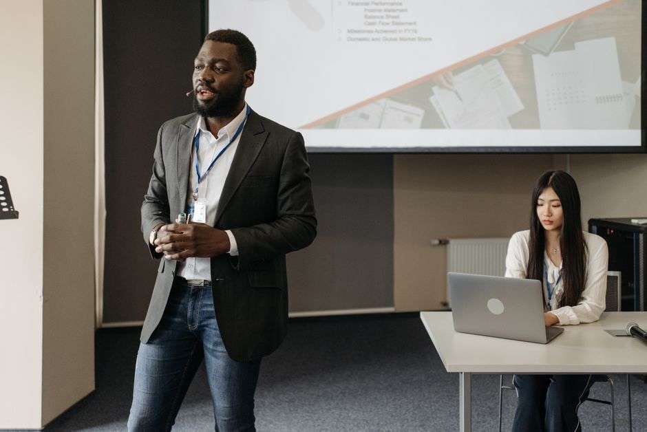 Students giving a presentation in an office setting