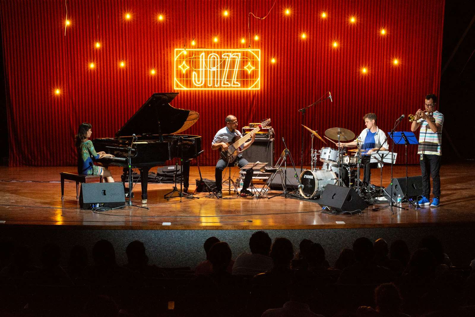 Musicians performing a live jazz set on stage