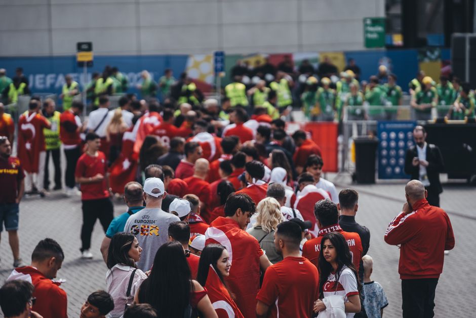 Crowded stadium concourse at a football game