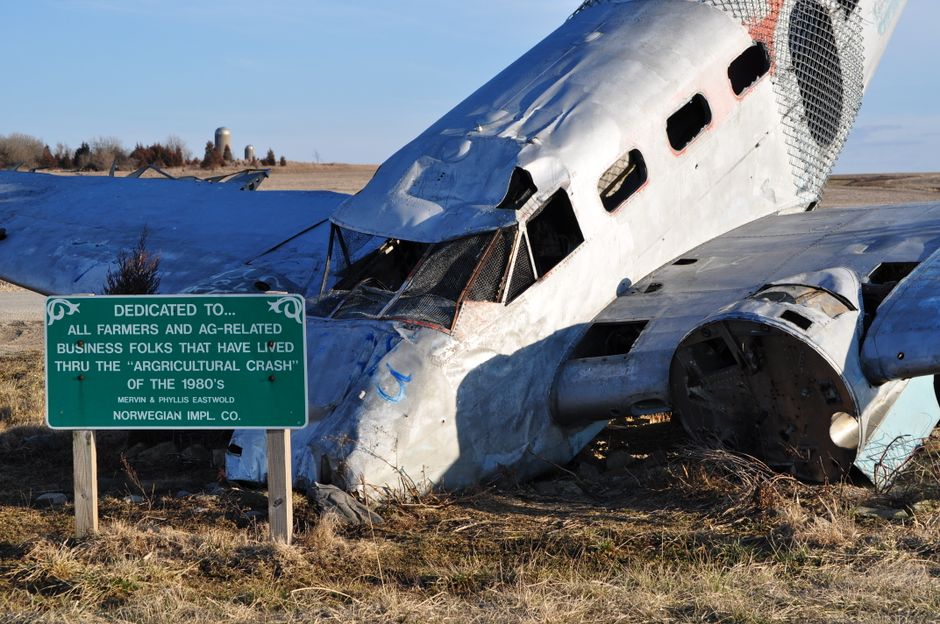 Small aircraft wreckage in a rural field