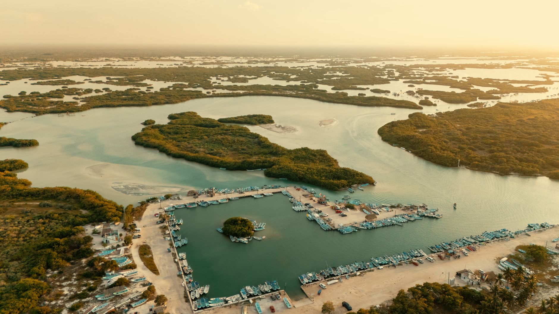 Aerial view of a coastal lagoon bordered by marsh and undeveloped shoreline