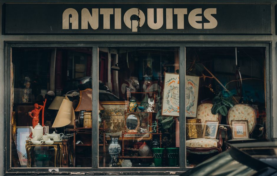 Historic antique furniture and estate items displayed in a shop