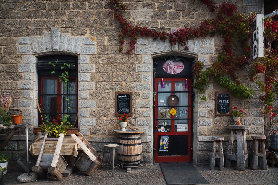 An old brick storefront building typical of a historic small-town bar and restaurant like those found in Old Towne Daphne