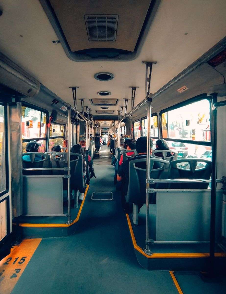 Passengers seated aboard a city public transit bus