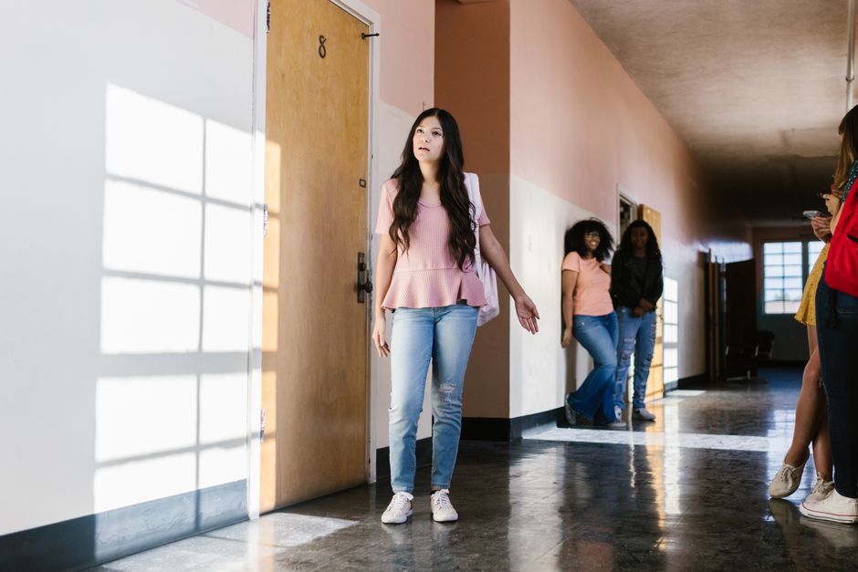 School hallway with lockers representing a public school system