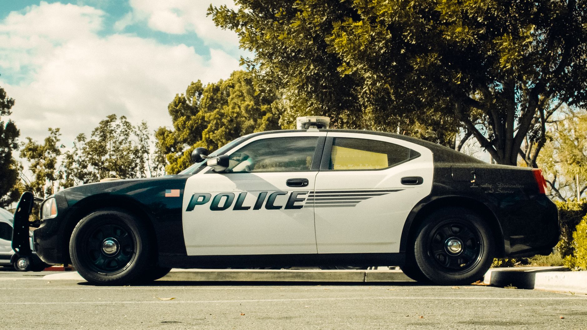 A police patrol vehicle parked outside a municipal police department