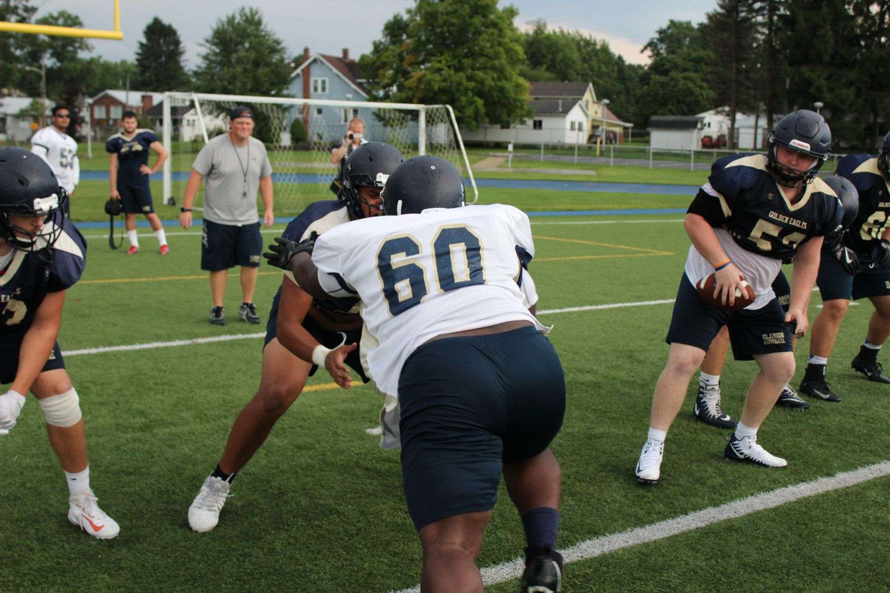 American football players lined up in formation during practice