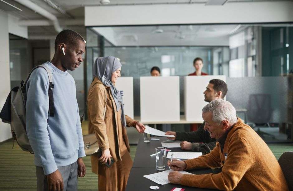 Voters cast ballots at a polling place during a local election