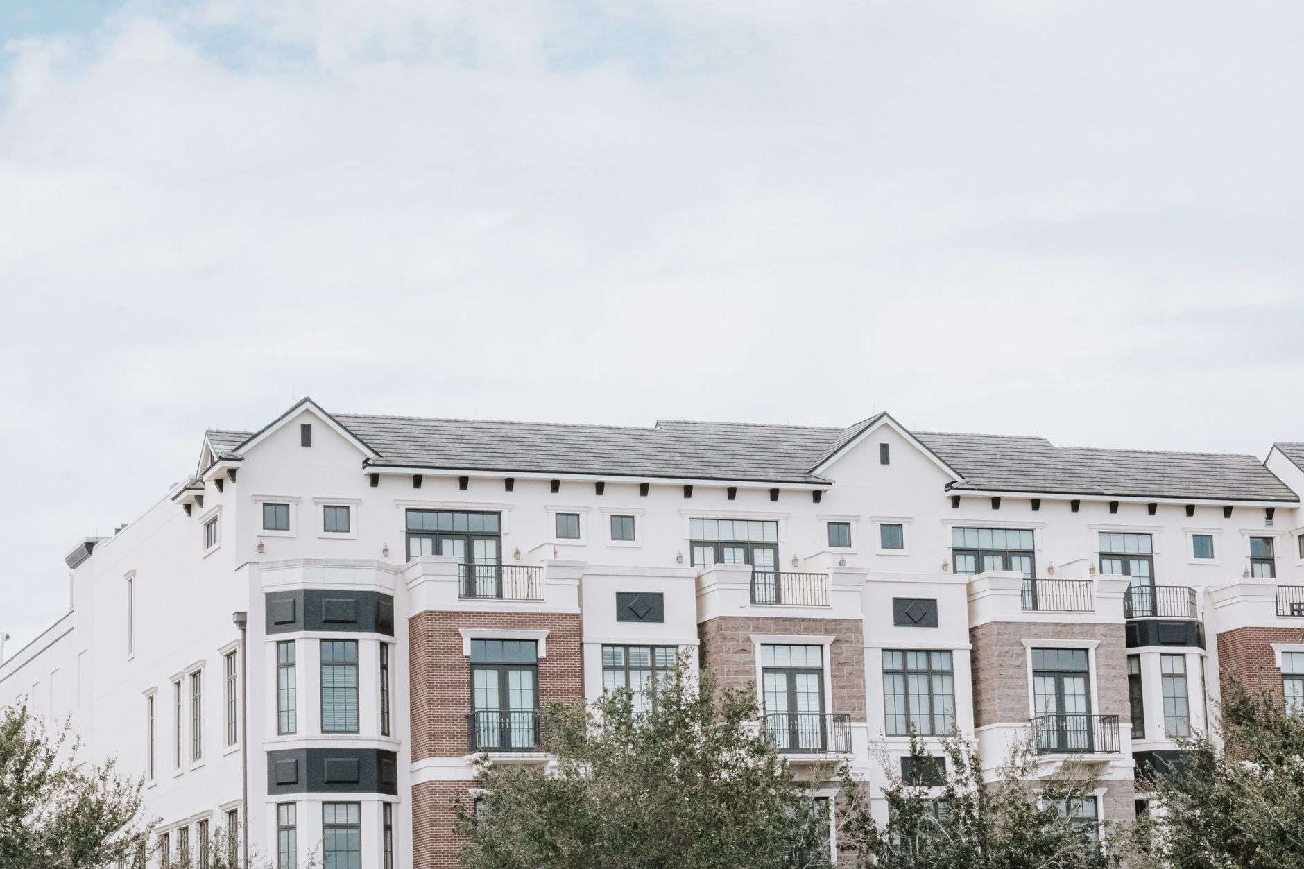 Exterior view of a modern multi-story apartment complex