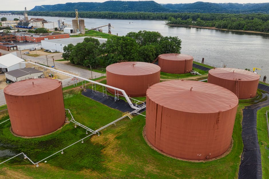 Industrial storage tanks along a waterfront similar to those proposed by Arc Terminals in Mobile