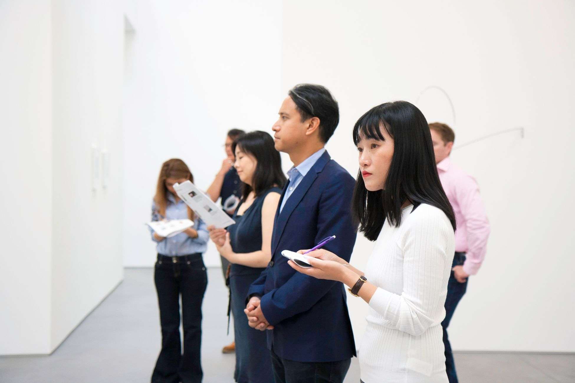 Attendees admire artwork during a Mobile arts community celebration