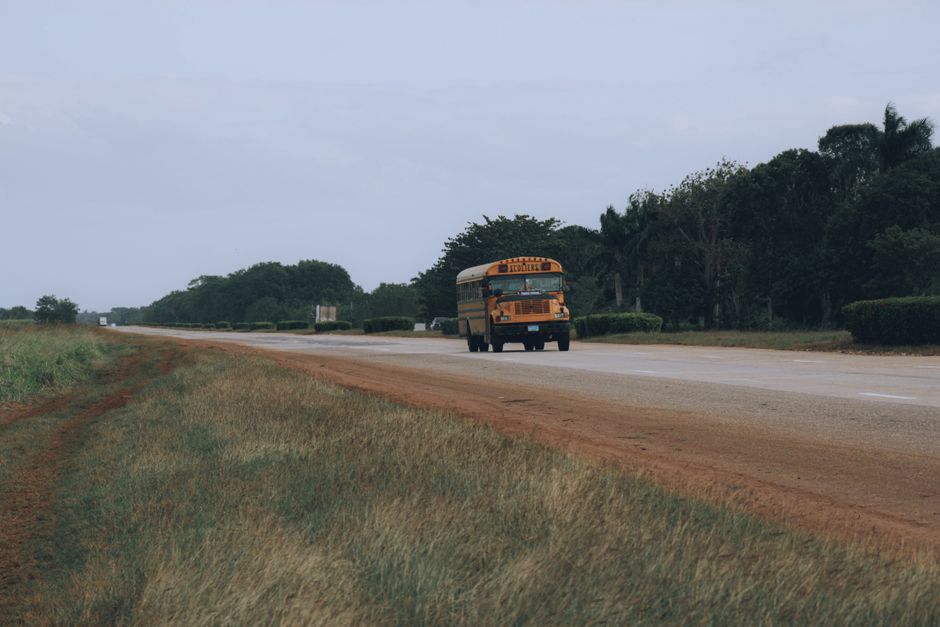 Yellow school bus traveling a rural road in South Alabama