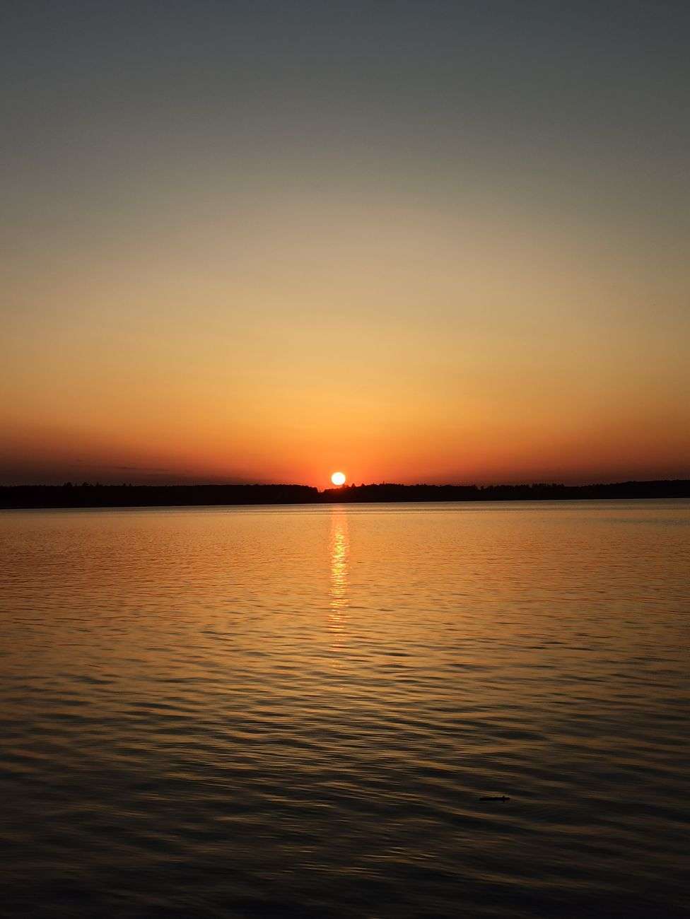 Calm, still waters of Mobile Bay near Point Clear at sunrise