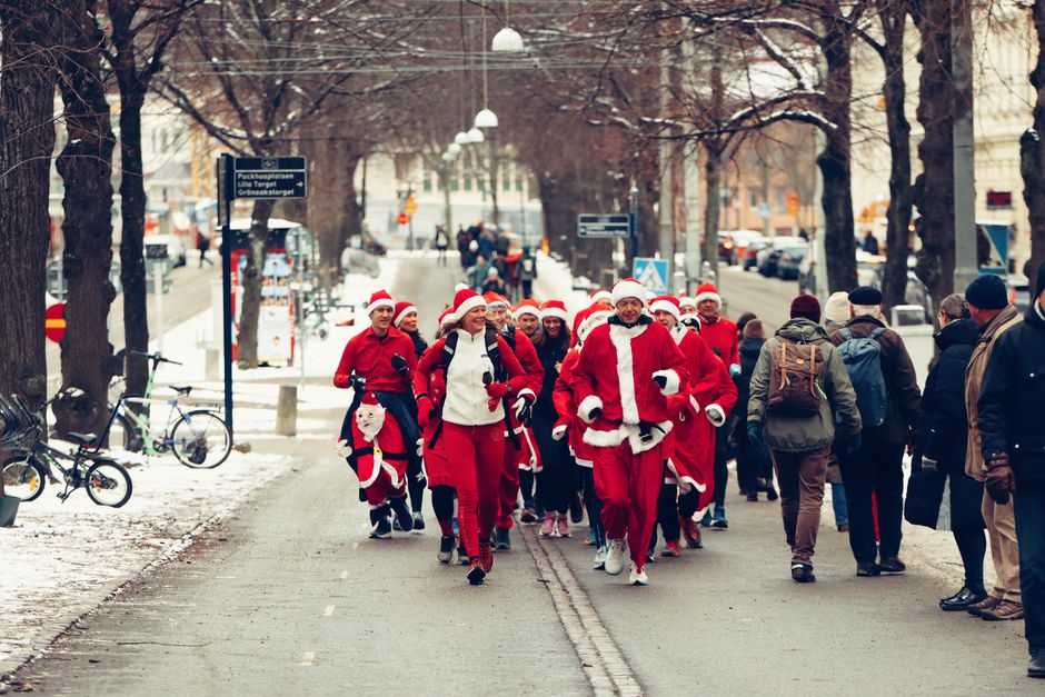 Runners dressed as Santa taking part in a holiday charity run