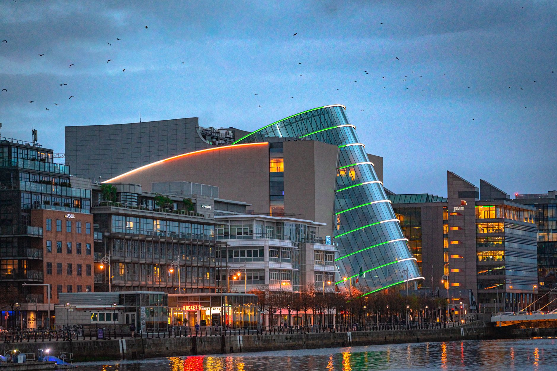 Modern waterfront convention center beside a river downtown