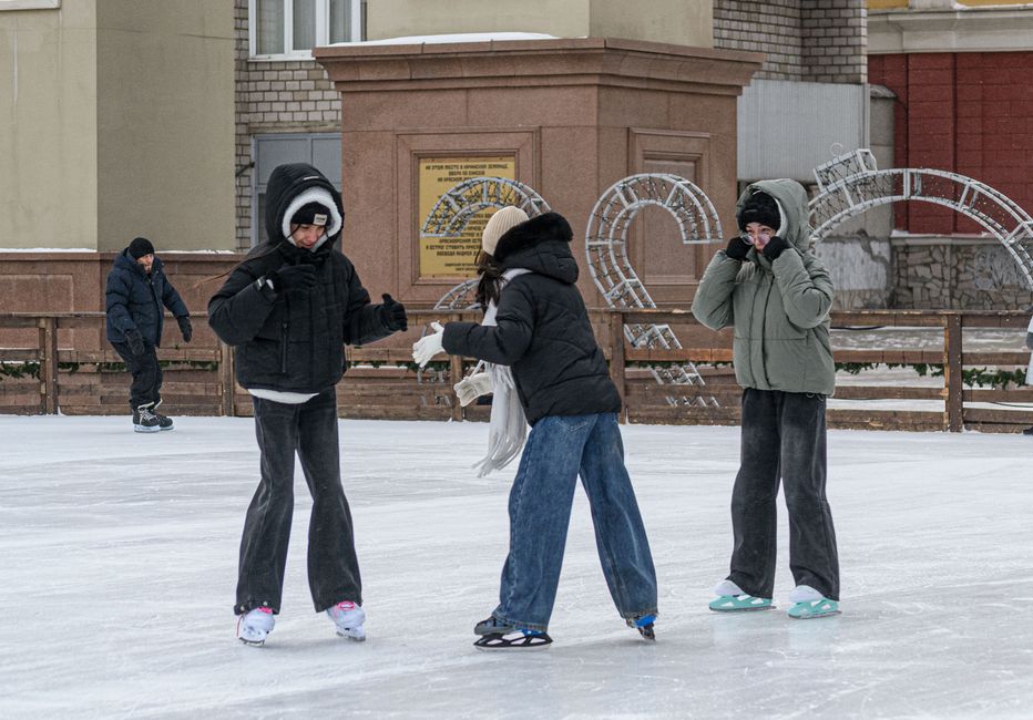 Outdoor ice skating rink set up in a city park