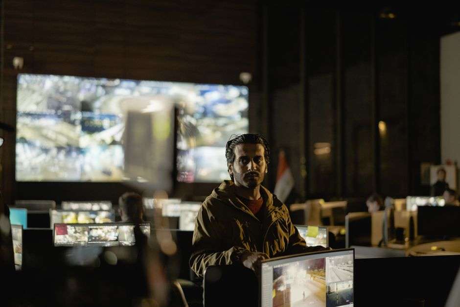 Dispatchers monitor screens in an emergency operations and communications control room