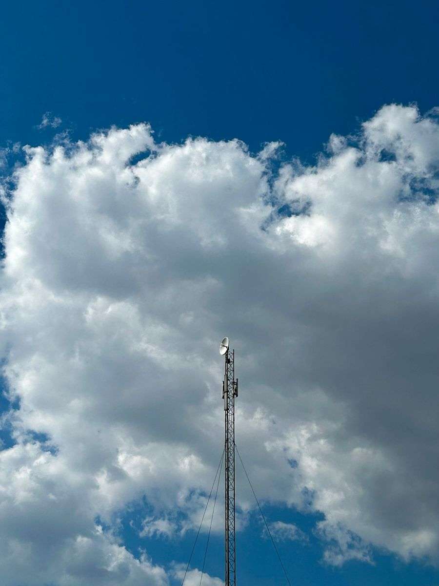 A tall radio communications tower against the sky