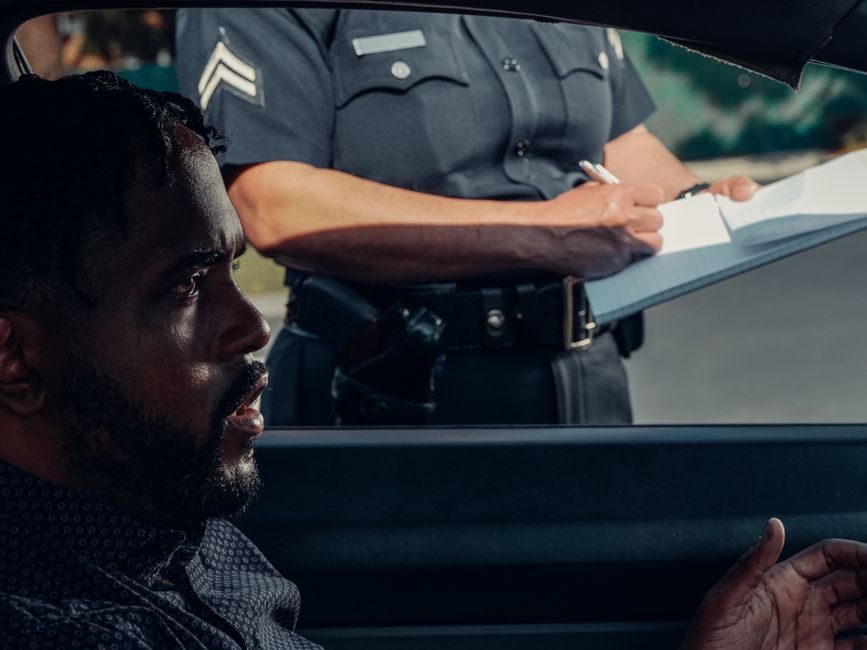 A police vehicle during a highway traffic stop, representing civil asset forfeiture cases in Mobile County