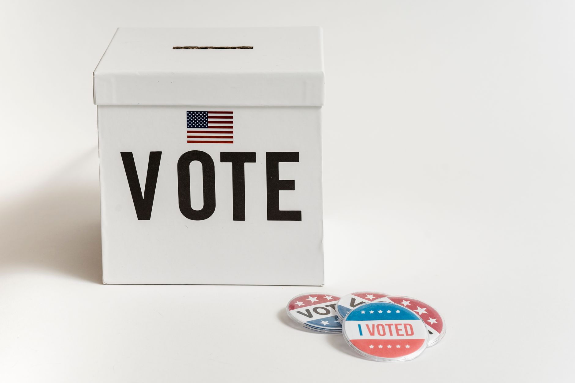 Cash and a ballot box representing campaign finance disclosure in local elections