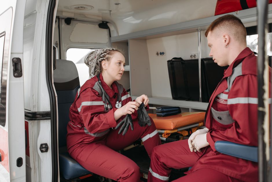Paramedics training with medical equipment