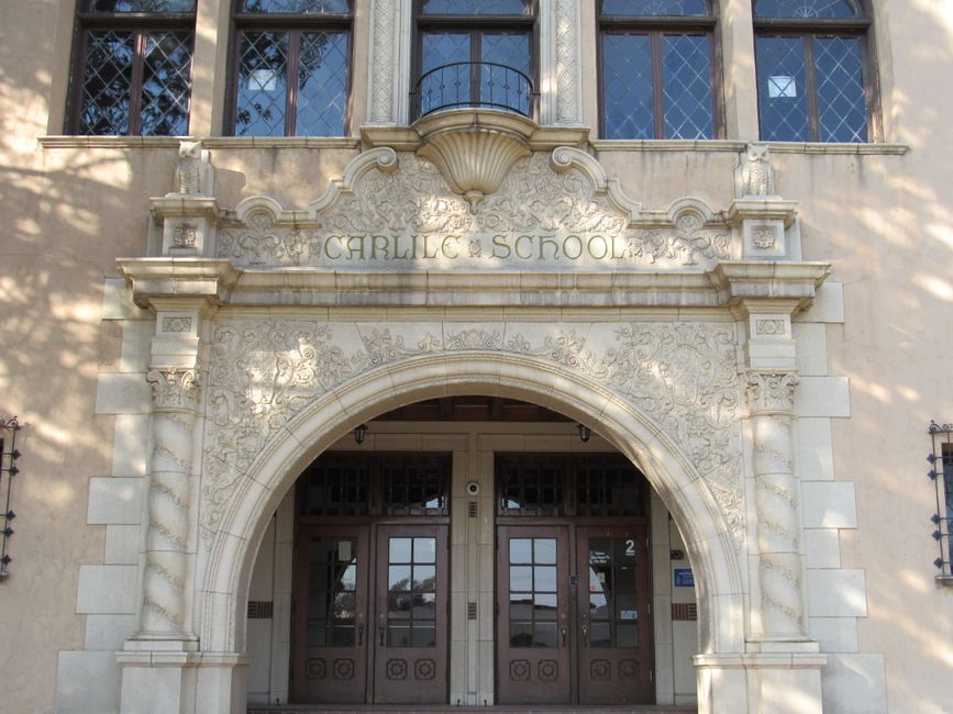 A historic brick school building undergoing restoration