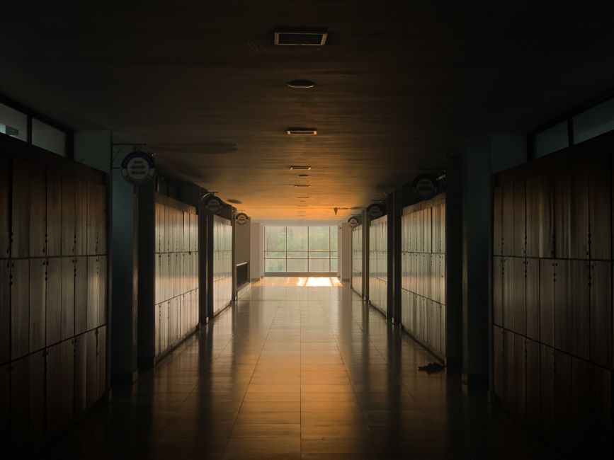 Empty school hallway representing district budget decisions