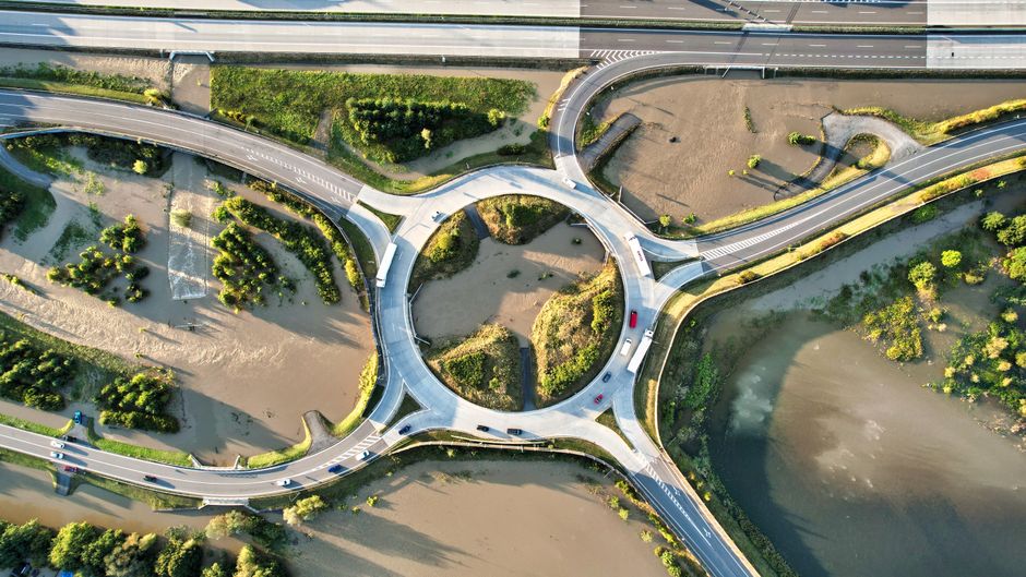 Road construction crew working on a roundabout intersection
