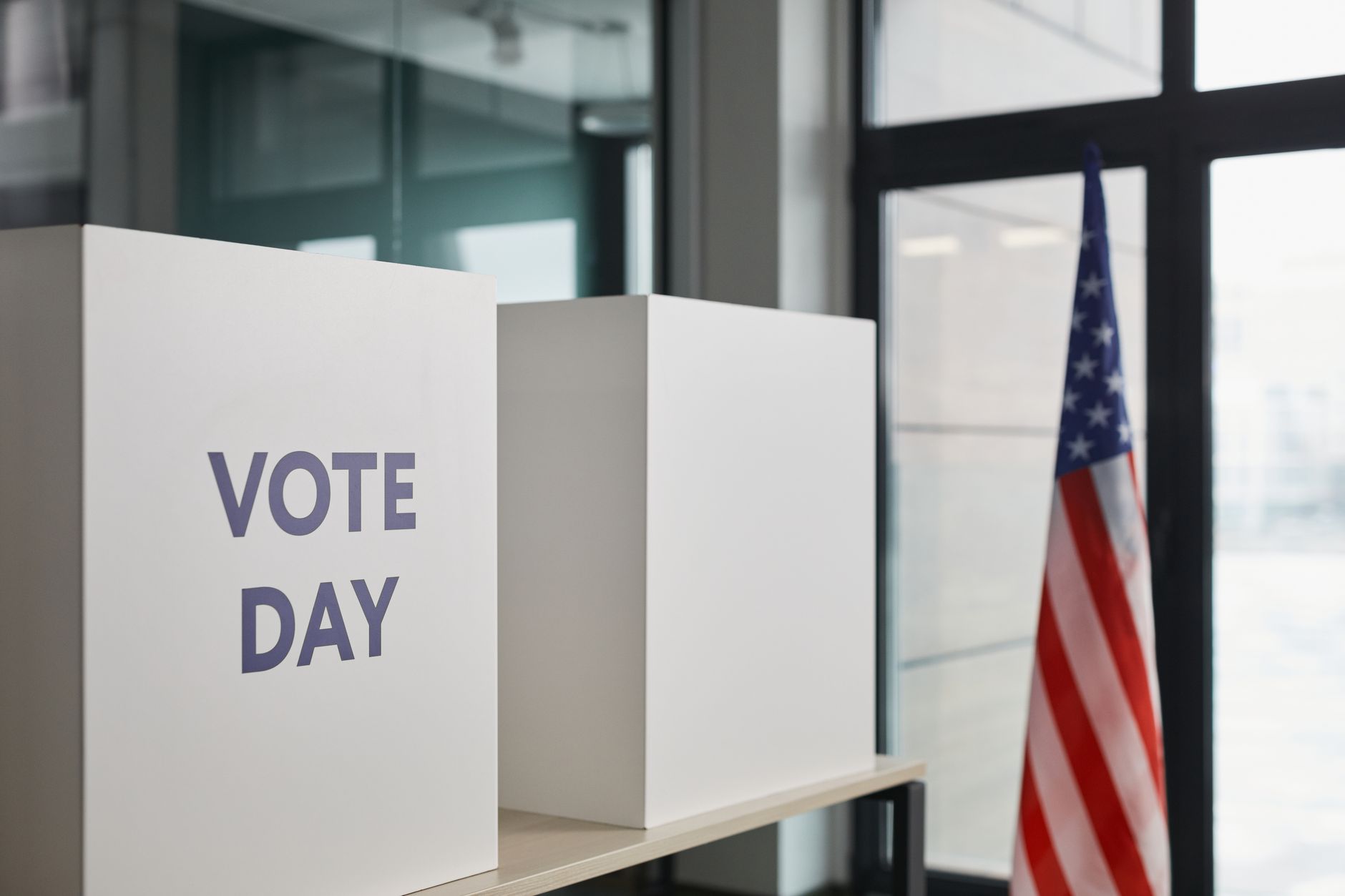 A voter casting a ballot in a polling place voting booth