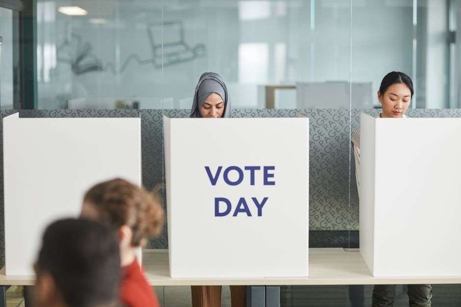 Voters cast ballots at a polling location during a municipal election