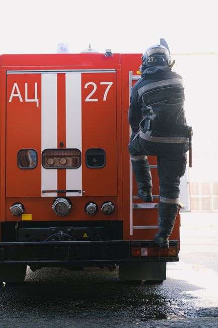 Firefighter in gear responding to an emergency call
